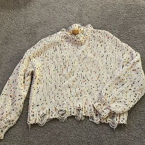 Multi colored Pom Pom sweater with tapered ends